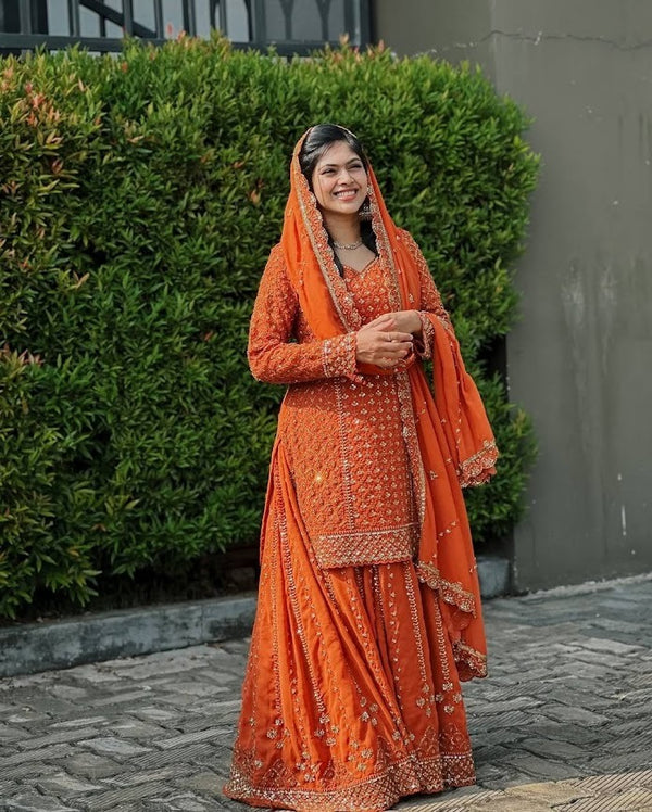 Radiate Festive Elegance in Classic Orange Embroidery