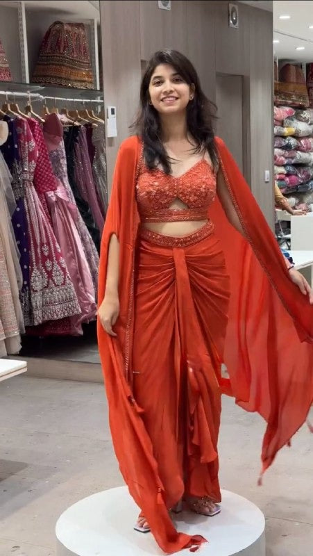 Vibrant Orange Dhoti Set with Embroidered Choli and Tassel Shrug